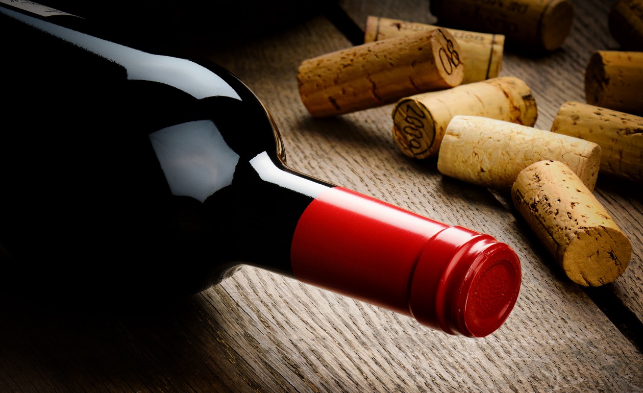 Bottle of red wine and corks